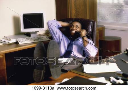 relaxation, desk, telephone, talking, computer, phone View Large Photo Image Stock Image - relaxation, desk, telephone, talking, computer, phone. Fotosearch