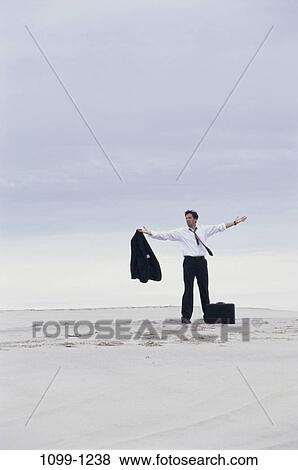 sand, desert, briefcase, Hispanic, deserted, overcast, business View Large Photo Image Stock Photo - sand, desert, briefcase, Hispanic, deserted, overcast, business. Fotosearch