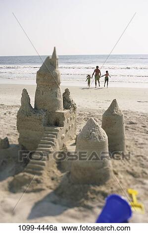 sand, people, beach, shovel, waves, shore, family View Large Photo Image Stock Image - sand, people, beach, shovel, waves, shore, family. Fotosearch