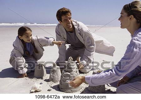 sand, people, building, beach, family, daughter View Large Photo Image Stock Image - sand, people, building, beach, family, daughter. Fotosearch