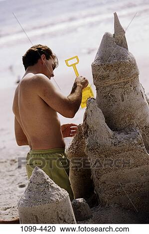 sand, people, building, playing, beach, sand castle View Large Photo Image Stock Image - sand, people, building, playing, beach, sand castle. Fotosearch