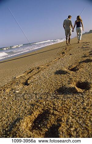 sand, people, hands, water, walking, couple, beach View Large Photo Image Stock Image - sand, people, hands, water, walking, couple, beach. Fotosearch