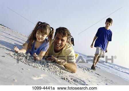 sand, people, water, playing, walking, sea, beach View Large Photo Image Stock Image - sand, people, water, playing, walking, sea, beach. Fotosearch