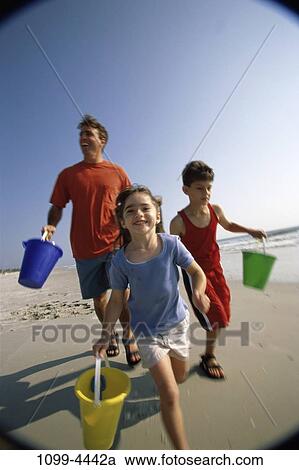sand, people, water, running, smiling, playing, sea View Large Photo Image Stock Image - sand, people, water, running, smiling, playing, sea. Fotosearch