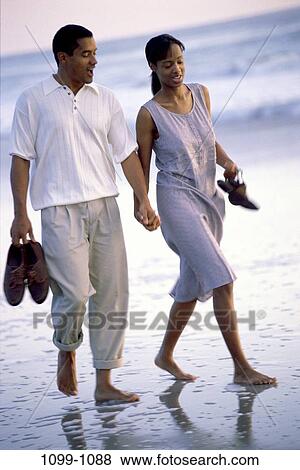 sand, people, water, walking, couple, ocean, happy View Large Photo Image Stock Photo - sand, people, water, walking, couple, ocean, happy. Fotosearch