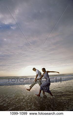 sky, people, reflection, water, running, clouds, walking View Large Photo Image Stock Photo - sky, people, reflection, water, running, clouds, walking. Fotosearch