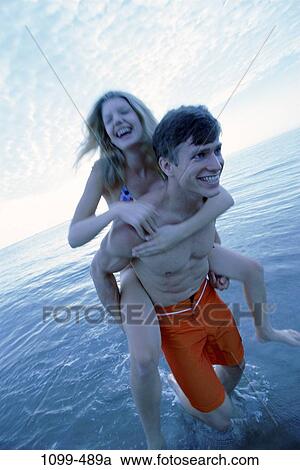 sky, people, walking, couple, ocean, friendship, beach View Large Photo Image Stock Image - sky, people, walking, couple, ocean, friendship, beach. Fotosearch