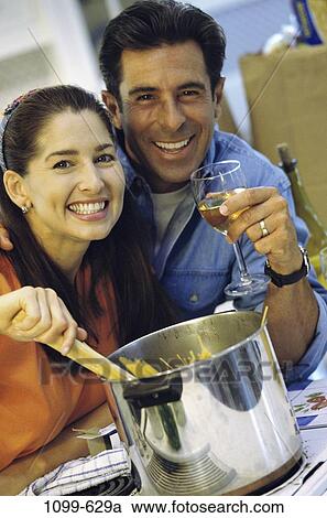 smiling, couple, wine, bottle, pasta, cooking, happy View Large Photo Image Stock Image - smiling, couple, wine, bottle, pasta, cooking, happy. Fotosearch