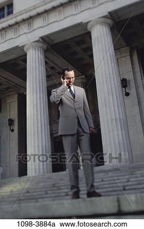 suit, talking, conversation, columns, cell phone, businessman, Caucasian View Large Photo Image Stock Image - suit, talking, conversation, columns, cell phone, businessman, Caucasian. Fotosearch