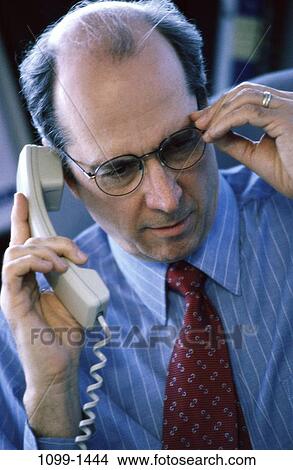 telephone, talking, eyeglasses, phone, business View Large Photo Image Picture - telephone, talking, eyeglasses, phone, business. Fotosearch