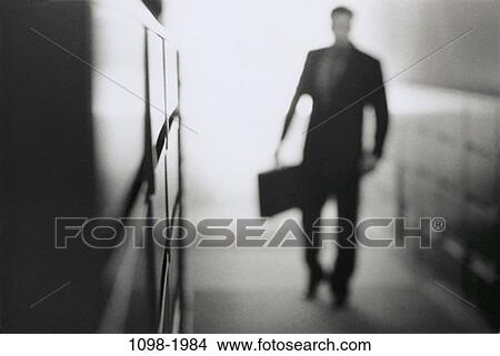 walking, briefcase, business, mysterious, businessman, indoors View Large Photo Image Picture - walking, briefcase, business, mysterious, businessman, indoors. Fotosearch