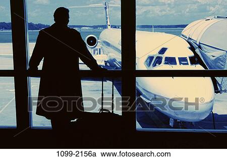 watching, windows, Middle-aged, business, silhouette, airplane View Large Photo Image Stock Image - watching, windows, Middle-aged, business, silhouette, airplane. Fotosearch