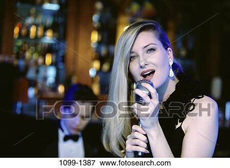 woman, music, arts, entertainment, nightlife, singing View Large Photo Image Stock Photo - woman, music, arts, entertainment, nightlife, singing. Fotosearch