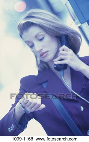 woman, time, telephone, pay phone, phone, watch, business View Large Photo Image Stock Photo - woman, time, telephone, pay phone, phone, watch, business. Fotosearch