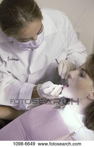 women, patient, dentist, doctor, cleaning, health, professional View Large Photo Image Stock Photo - women, patient, dentist, doctor, cleaning, health, professional. Fotosearch
