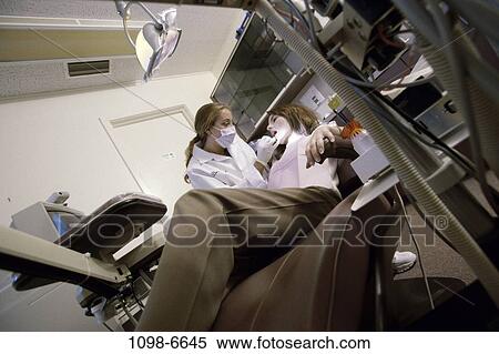 Stock Photography - women, patient, dentist, doctor, cleaning, health, professional. Fotosearch