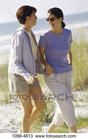 women, people, walking, talking, friendship, beach, laughing View Large Photo Image Stock Image - women, people, walking, talking, friendship, beach, laughing. Fotosearch