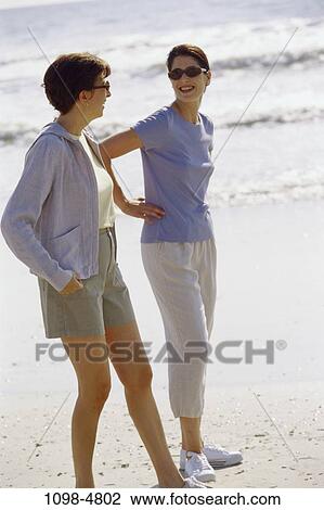 women, people, water, walking, talking, listening, friendship View Large Photo Image Stock Image - women, people, water, walking, talking, listening, friendship. Fotosearch