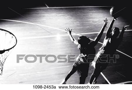 Stock Image - women, playing, ball, basketball, play, game, opponents. Fotosearch