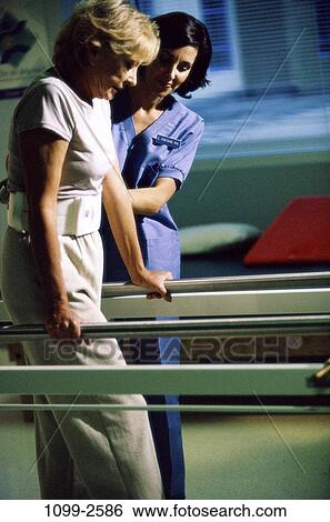 Stock Photograph - women, walking, patient, physical, rails, trying, helping. Fotosearch