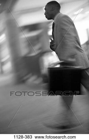Stock Image - briefcase, rush, motion, business, outdoors, speed. Fotosearch