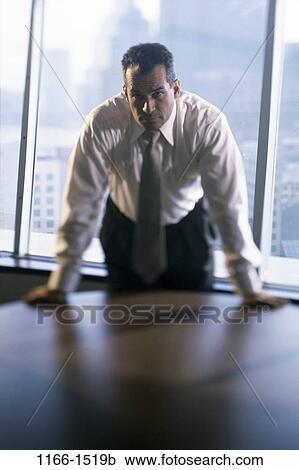 business, Middle-aged, serious, businessman, indoors View Large Photo Image Stock Image - business, Middle-aged, serious, businessman, indoors. Fotosearch