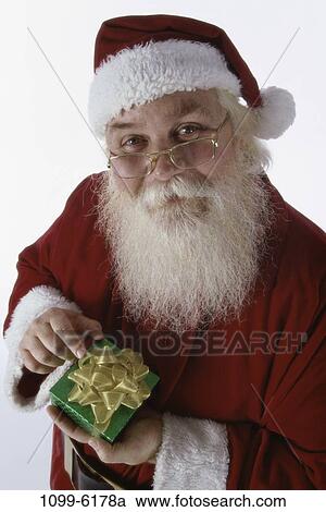 Christmas, holding, gift, hold, indoors, holiday View Large Photo Image Stock Image - Christmas, holding, gift, hold, indoors, holiday. Fotosearch