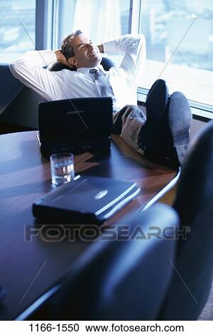 desk, laptop, business, Middle-aged, relaxing View Large Photo Image Stock Image - desk, laptop, business, Middle-aged, relaxing. Fotosearch