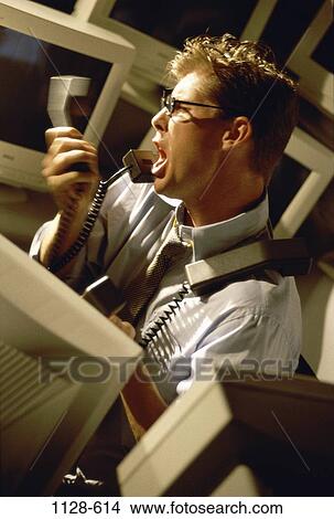Picture - desk, shouting, talking, eyeglasses, stress, chaotic. Fotosearch