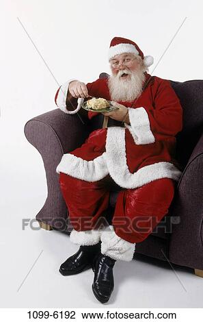 eating, suit, chair, sitting, slice, pie, Christmas View Large Photo Image Stock Image - eating, suit, chair, sitting, slice, pie, Christmas. Fotosearch
