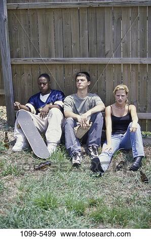 fence, multiethnic, drinking, alcohol, smoking, teens View Large Photo Image Stock Photo - fence, multiethnic, drinking, alcohol, smoking, teens. Fotosearch