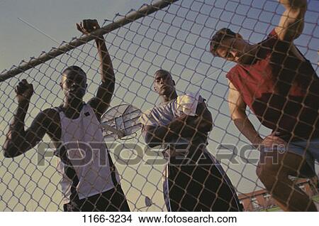 fence, multiethnic, men, people, urban, staring, outdoors View Large Photo Image Picture - fence, multiethnic, men, people, urban, staring, outdoors. Fotosearch