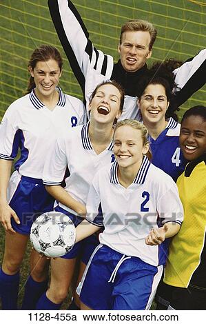 Stock Image - Field, multiethnic, success, excitement, excited, ball, outdoors. Fotosearch