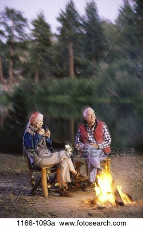 fire, people, relaxation, couple, senior, drinking, outdoors View Large Photo Image Stock Image - fire, people, relaxation, couple, senior, drinking, outdoors. Fotosearch