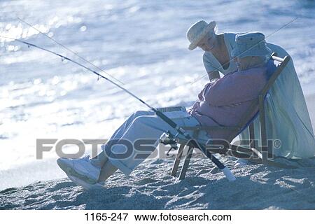 fish, sand, people, water, sleeping, couple, chair View Large Photo Image Stock Photo - fish, sand, people, water, sleeping, couple, chair. Fotosearch