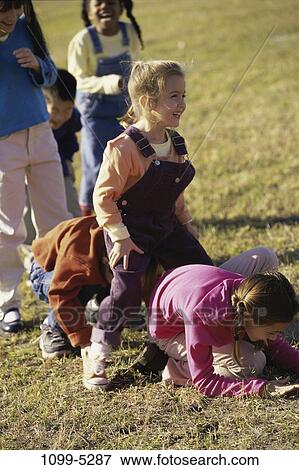 grass, multiethnic, people, playing, laughing, playground, outdoors View Large Photo Image Stock Photo - grass, multiethnic, people, playing, laughing, playground, outdoors. Fotosearch