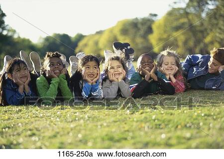 grass, multiethnic, people, smiling, ground, watch View Large Photo Image Stock Image - grass, multiethnic, people, smiling, ground, watch. Fotosearch