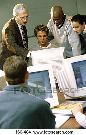 Picture - group, multiethnic, instructing, people, teacher, school, computers. Fotosearch