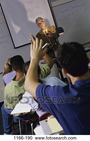 Stock Image - group, multiethnic, instructing, people, teacher, school, classroom. Fotosearch