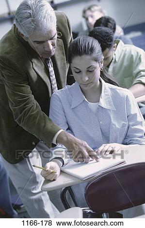 group, multiethnic, instructing, people, teacher, school, explaining View Large Photo Image Stock Photo - group, multiethnic, instructing, people, teacher, school, explaining. Fotosearch