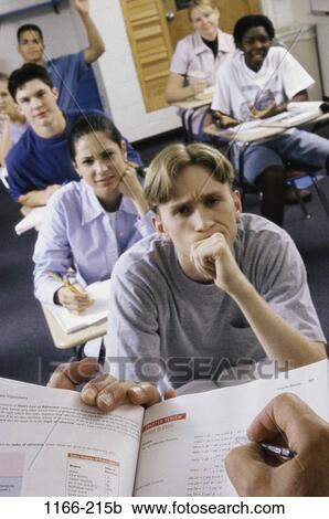 Stock Image - group, multiethnic, people, listening, school, classroom, book. Fotosearch