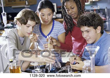 Stock Image - group, multiethnic, people, school, testing, education, learning. Fotosearch