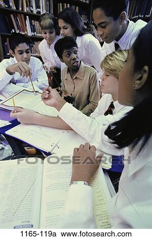 Stock Image - group, multiethnic, people, teacher, books, school, library. Fotosearch