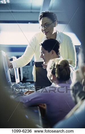 group, multiethnic, people, teacher, computer, classroom, education View Large Photo Image Stock Photograph - group, multiethnic, people, teacher, computer, classroom, education. Fotosearch