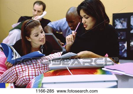 Stock Photography - group, multiethnic, telephone, laptop, phone, business, concepts. Fotosearch