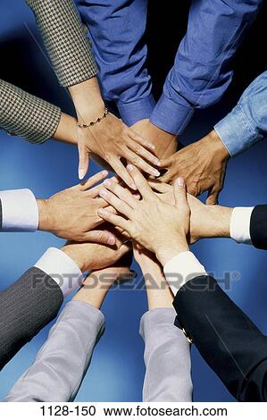 Stock Image - hands, business, miscellany, concepts, body parts, teamwork, commitment. Fotosearch