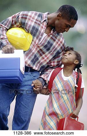 Stock Photograph - holding, people, backpack, talking, hands, hard hat, attentive. Fotosearch