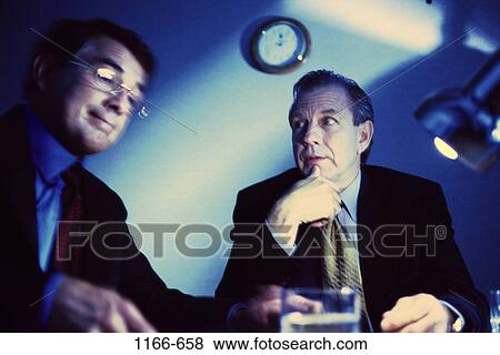 meeting, men, clock, night, talking, discussion, conversation View Large Photo Image Stock Photo - meeting, men, clock, night, talking, discussion, conversation. Fotosearch