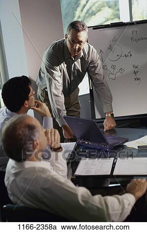meeting, men, laptop, business, businessmen, indoors View Large Photo Image Stock Image - meeting, men, laptop, business, businessmen, indoors. Fotosearch