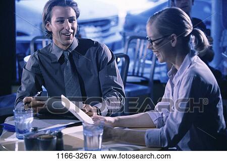 meeting, smiling, talking, discussion, papers, business, restaurant View Large Photo Image Stock Image - meeting, smiling, talking, discussion, papers, business, restaurant. Fotosearch